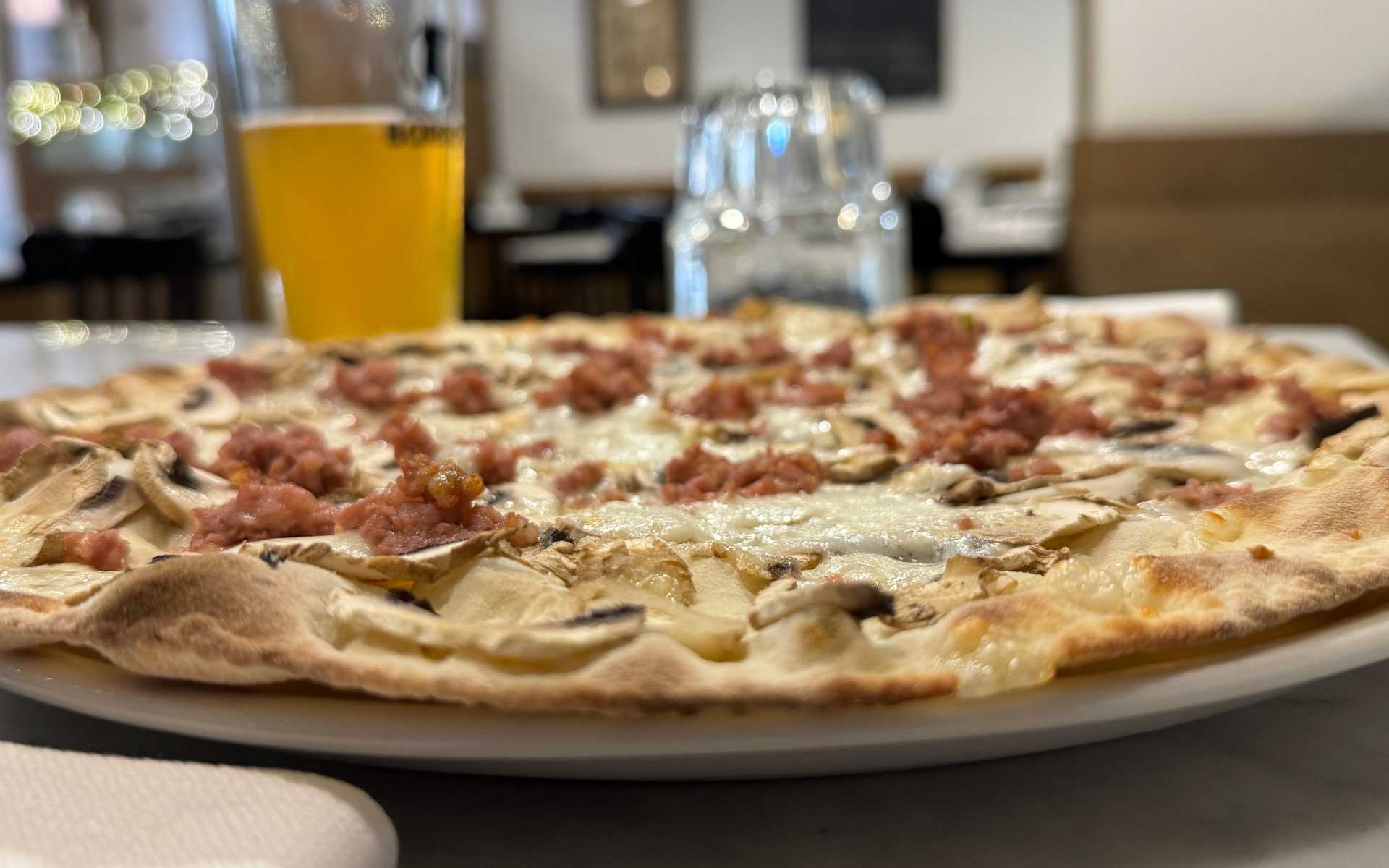 Pizza with mushrooms and sausages