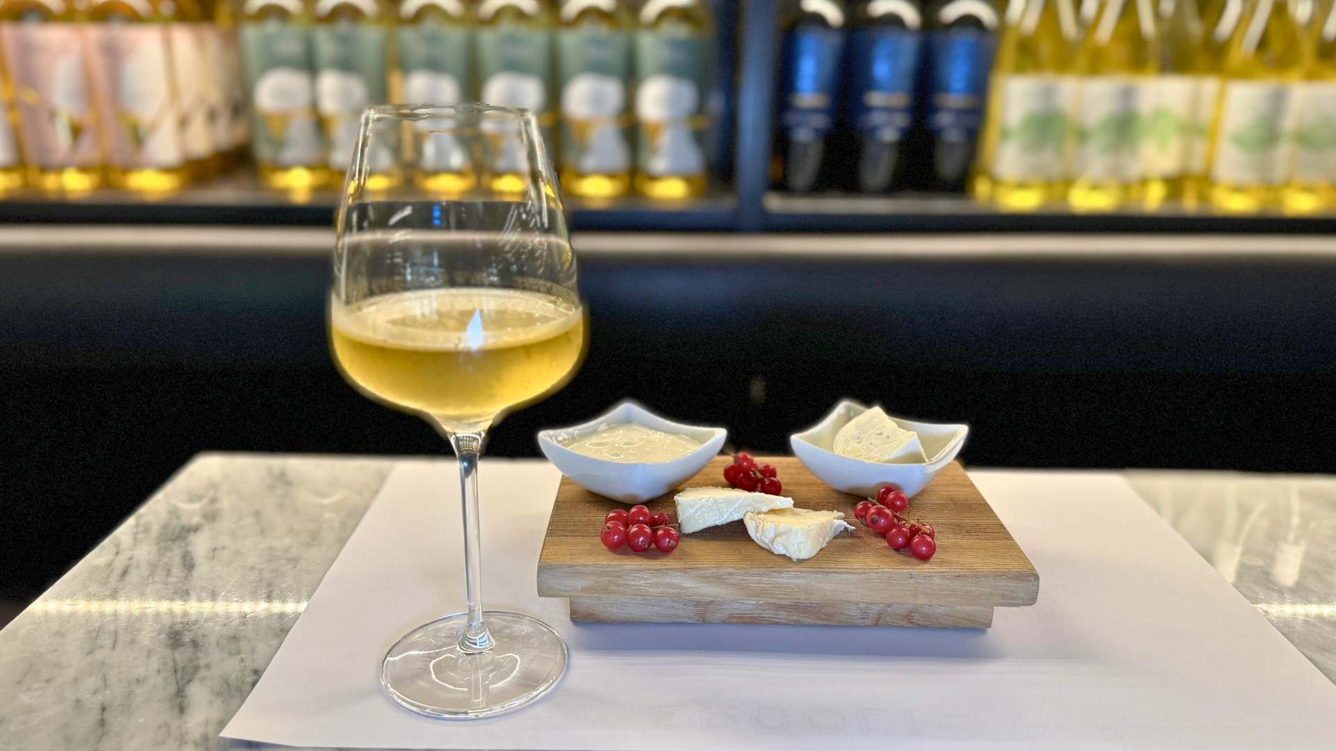 wine glass and cheese platter